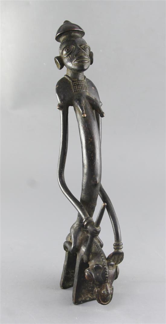 A Sao / Katoko bronze divination figure of a female woman holding a staff of power, height 44cm